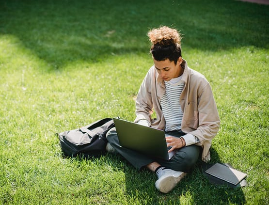 student-laptop-lawn