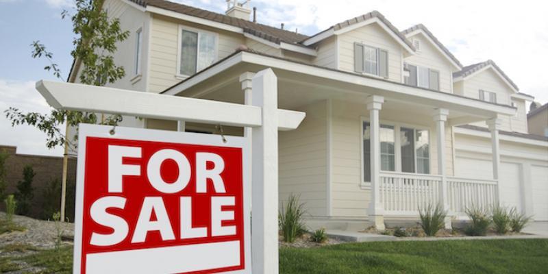Home with For Sale sign